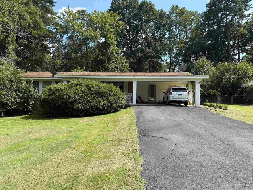 Charming all brick 3 bedroom 2 bath home located in Lakeside School District, but outside of city limits. This all electric property offers a spacious double carport and oversize deck, perfect for entertaining or enjoying some quiet evenings outdoors. The large fenced backyard includes a darling barn style building 24X16' for storage, a workshop or creative space, it could be turned into mother-in-law suite. Home does need some TLC.