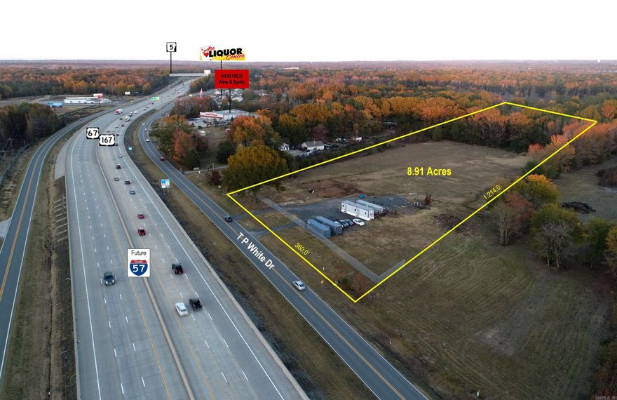 8.91 Acres on T. P. White Drive.  Superior visibility from I-57.  Estimated traffic count of 55,000 vpd.  Property is zoned C-4 w/360' frontage.  6' Security fence in front w/automatic gate.  Utilities installed for new construction.  Existing mobile office unit could be purchased separately. Call for more information!