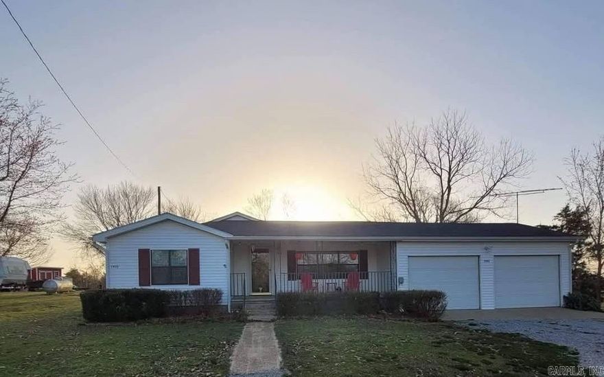 Ringing in the New Year, with this highly motivated Seller, giving away $12,000.00 in concession savings to you, off the original asking price of $170,000.00, combined with an amazing L – shaped back porch, with spectacular views sitting on a just shy of a 1 acre lot.   The Ozark National Forest trail a stone’s throw down the road has ample ATV trails, water streams, and an abundance of wildlife, beauty, and attractions.    Updates include: ceiling fans, interior paint, bathroom toilet, water lines with shut off valves, propane upgrades, propane hot water heater, both vertical and horizontal vinyl blinds, emergency water shut off valve at the city water meter, and a water draw spicket out on the property.  This incredible 3-bedroom, 1 bath, features: Back porch mountainous views, wrap around L shaped back porch, 2 large storage buildings, a two-stall metal barn, large 2 car attached garage, walk in storm cellar, burn / campfire pit, front porch, central propane forced heat and central air, septic system, city water, water collection cistern, attic fan, and so much more.  Welcome Home to the Country!
