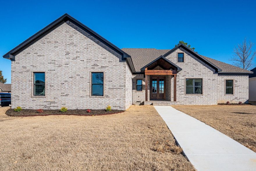 4 bedroom, 2.5 bath split floor plan new construction on corner lot in Ivy Place. Low maintenance exterior w/ tongue in groove covered patio & porch. You'll fall in love with this carefully crafted home designed for luxury and comfort.   Several unique features set this home apart! 8 ft tall double mahogany doors and fully fenced backyard make move in day an absolute breeze. Over size walk in pantry with plenty of shelving and natural light. Laundry room has additional sink and folding/hanging areas and is convenient to mud room area and primary bedroom. Mud room has cubbies & cabinets above!  Upgraded Frigidaire Gallery kitchen appliances, 36' gas cooktop, pot filler, microwave, and wall oven with built in air fryer are surrounded by a plethora of cabinets custom built by the builder himself. Large 8 foot white oak island with gorgeous quartz countertop and adjacent coffee bar that is open to spacious living room complete with gas insert fireplace and custom wood mantle.   Primary bath has large soaker tub & tiled walk in shower. Closet is 7x14 w/ 4 foot wide chest of drawers. Furnace upgraded to 95% efficient Rheem model.