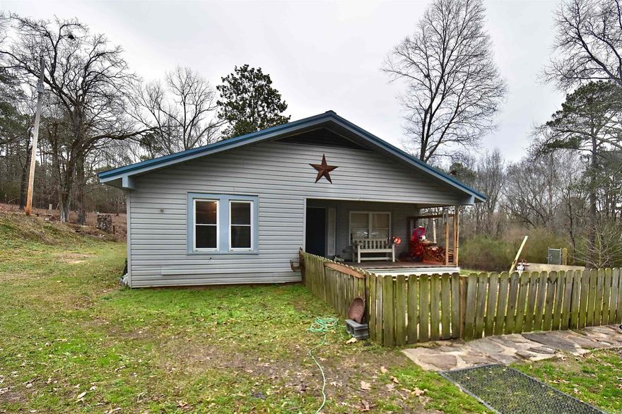 Welcome to 356 & 340 Pleasant Hill Road, a charming country retreat offering space and comfort on 2.3 fully fenced acres. Inside this 4-bed 2-bath home, you can find both space and charm. The open dining and kitchen combination creates an inviting gathering space, perfect for everyday living and entertaining. A cozy wood-burning stove adds warmth and character, making the home especially inviting during cooler months. The spacious bathroom is designed for comfort and convenience, featuring a relaxing jacuzzi tub and a dedicated makeup vanity area. Outside you will find a small barn ready for your livestock or additional storage. The fenced acreage offers room to roam and endless possibilities for gardening, animals, or outdoor recreation. A detached shop enhances the property even further and features a covered outdoor patio area with a custom outdoor fireplace. An ideal space for entertaining, gatherings, or relaxing evenings with friends and family. A mobile home also sits on the property for additional living quarters. Do not miss this opportunity to call 356 Pleasant Hill Rd home!