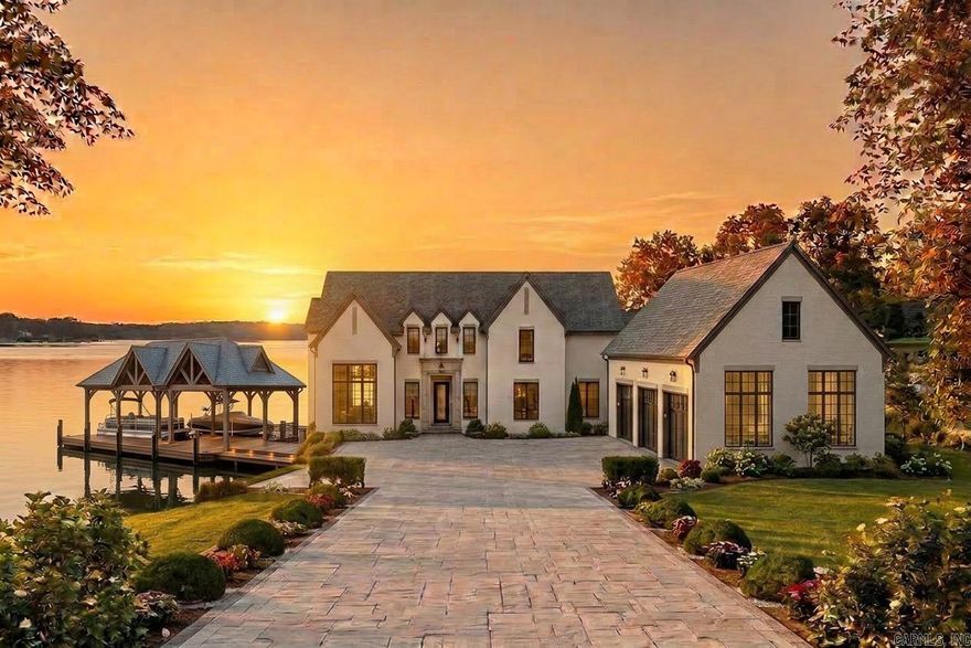 Proposed new construction by EY Custom Homes on Pennington Point, Lake Hamilton. This stunning 5,218 SF Transitional European residence designed by Tim Landreth Home Designs features 5 bedrooms, 4 full baths, and a half bath across two levels. Main level offers 10-ft ceilings, an open living area with two-story ceiling and stone fireplace, chef’s kitchen with gas cooktop, double ovens, butler’s pantry, and a hidden room. Luxurious owner’s suite with freestanding tub, oversized shower with bench, and walk-in closet. Covered porch with outdoor kitchen overlooks the lake. Upper level includes four additional bedrooms, a family room with vaulted ceilings, kitchenette, laundry, and generous storage. Dock with two covered boat slips. Office, built-ins, and thoughtful details throughout. Bring your buyers to Pennington Point — Lake Hamilton’s finest address.
