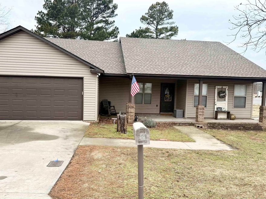 Beautifully maintained 3BR/2BA home offering 1,582 sq ft in a great location with a view of the city park from the backyard! Interior was freshly painted this week and features laminate and ceramic tile throughout — no carpet anywhere. The living room and primary bedroom both offer tray ceilings for added character. The spacious primary suite includes a jacuzzi tub/shower combo.  The kitchen features rich cabinetry, ample counter space, and a functional layout. Enjoy relaxing on the screened-in back porch overlooking the fenced backyard. There’s also a shop with electricity — perfect for hobbies, storage, or workspace.  All-electric home on a slab foundation with a 2-car garage and floored attic for extra storage. Roof replaced July 2023. HVAC and water heater-2017. Move-in ready and waiting for its next owner!