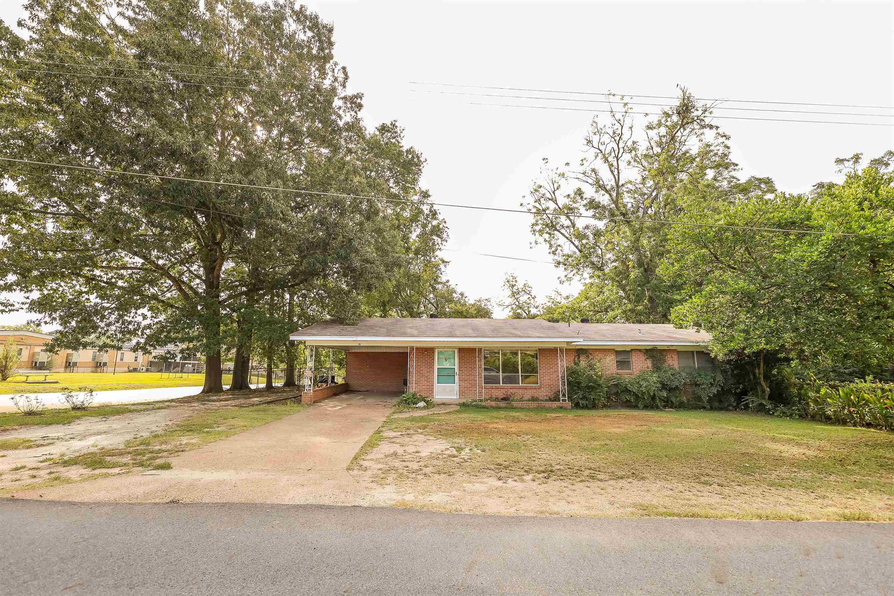 Are you ready to roll-up your sleeves and create something truly special? This 2 bedroom 2 bath brick home has endless potential, and it is waiting for just the right person to bring it back to life. The large windows in the living area flood the space with natural light. The generously sized kitchen and dining area are the perfect canvas for your renovation dreams. Outside, you will find a spacious backyard perfect for outdoor gatherings, gardening or simply relaxing. Located approx 20 minutes from both Camden and Magnolia, you can enjoy small town life and still be near to schools and shopping. Age, square footage and lot size all per county tax record.