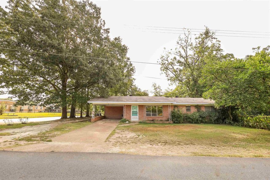 Are you ready to roll-up your sleeves and create something truly special?  This 2 bedroom 2 bath brick home has endless potential, and it is waiting for just the right person to bring it back to life.  The large windows in the living area flood the space with natural light.  The generously sized kitchen and dining area are the perfect canvas for your renovation dreams.  Outside, you will find a spacious backyard perfect for outdoor gatherings, gardening or simply relaxing.  Located approx 20 minutes from both Camden and Magnolia, you can enjoy small town life and still be near to schools and shopping.  Age, square footage and lot size all per county tax record.