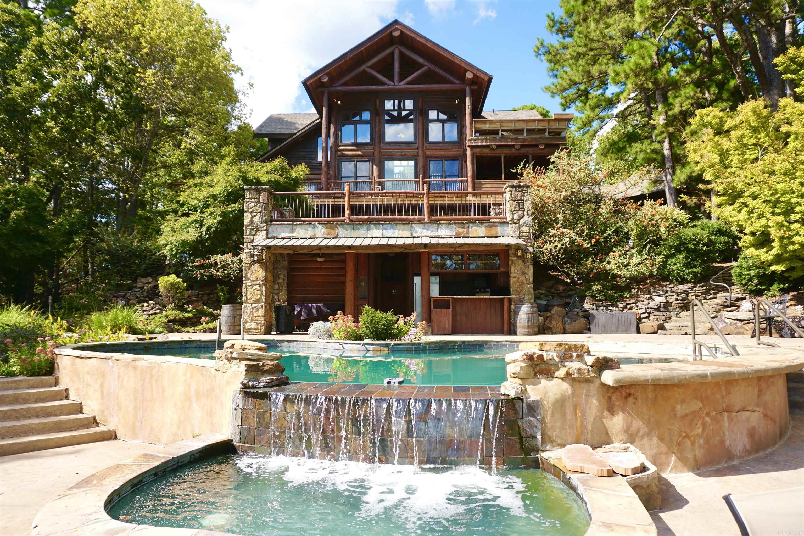 An Enchanting Evening is a premier wedding and event venue located just 20 minutes west of Little Rock. This stunning property combines natural beauty with well-designed event facilities, making it one of Central Arkansasās most desirable destination venues. The property features a handcrafted log lodge, spacious indoor and outdoor event areas, an infinity pool with waterfall, outdoor bar, dance floor, and multiple scenic ceremony locations overlooking Pinnacle Mountain and Lake Maumelle. A private honeymoon cabin and on-site winery tasting room provide additional income streams and elevate the guest experience. Perfectly positioned for continued growth, this turn-key business offers buyers the opportunity to own a well-established brand with a strong reputation, loyal clientele, and breathtaking surroundings. Located just 20 minutes west of Little Rock, this private estate overlooks Pinnacle Mountain and Lake Maumelle. Surrounded by wooded hillsides and natural scenery, the property offers a secluded setting with stunning panoramic views while still providing convenient access to the city. Turn-key operation - ALL FF&E INCLUDED IN SALE NDA and Financial Prequalification required