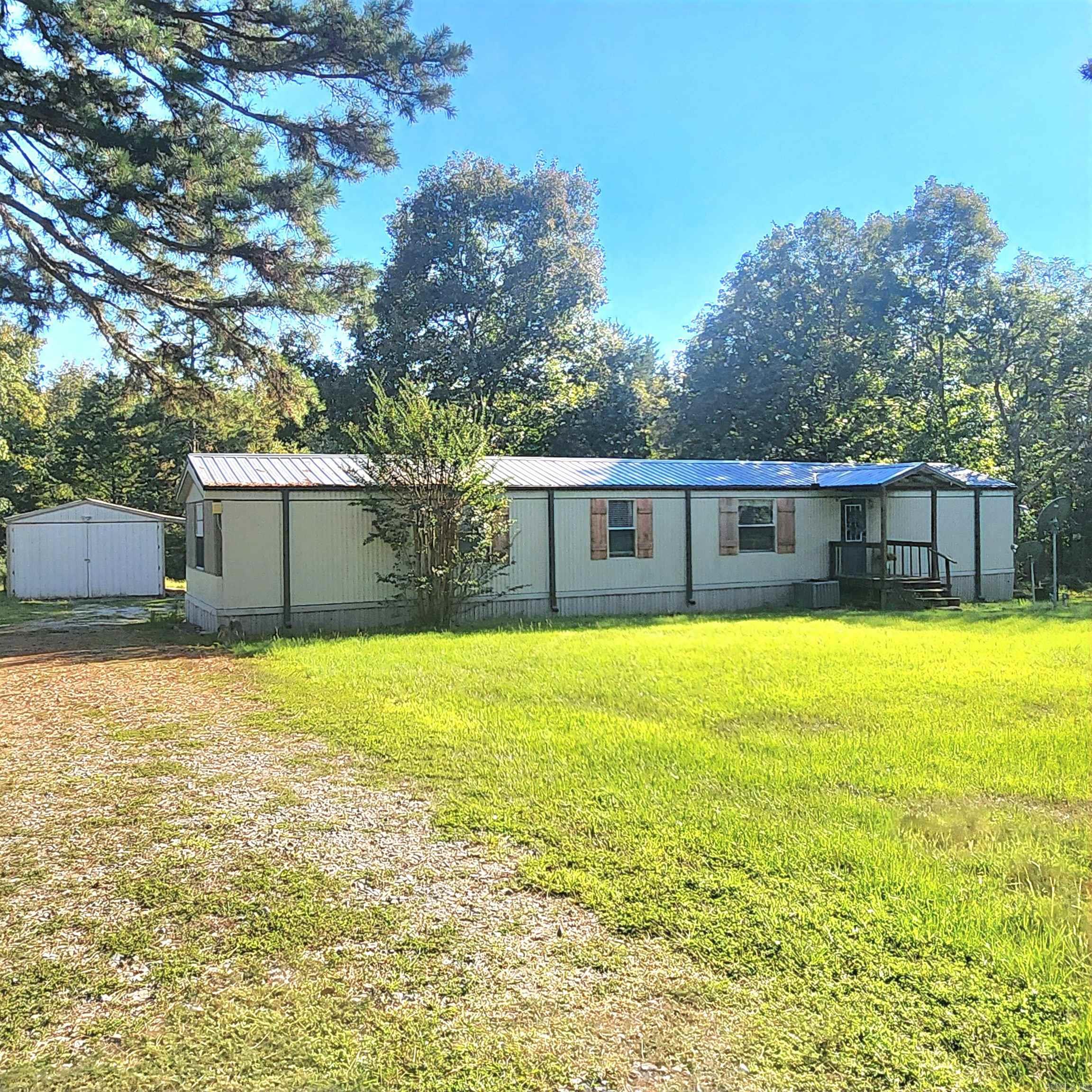 Furnished single wide mobile home in great condition sitting on approx .77 acres just 1.7 miles from Old Hwy 25 Boat launch on beautiful Greers Ferry Lake. Property offers back deck great for relaxing after a hard day of work or lake fun, fenced area for pets, and a detached garage with electricity. Come take a look, it won't disappoint.