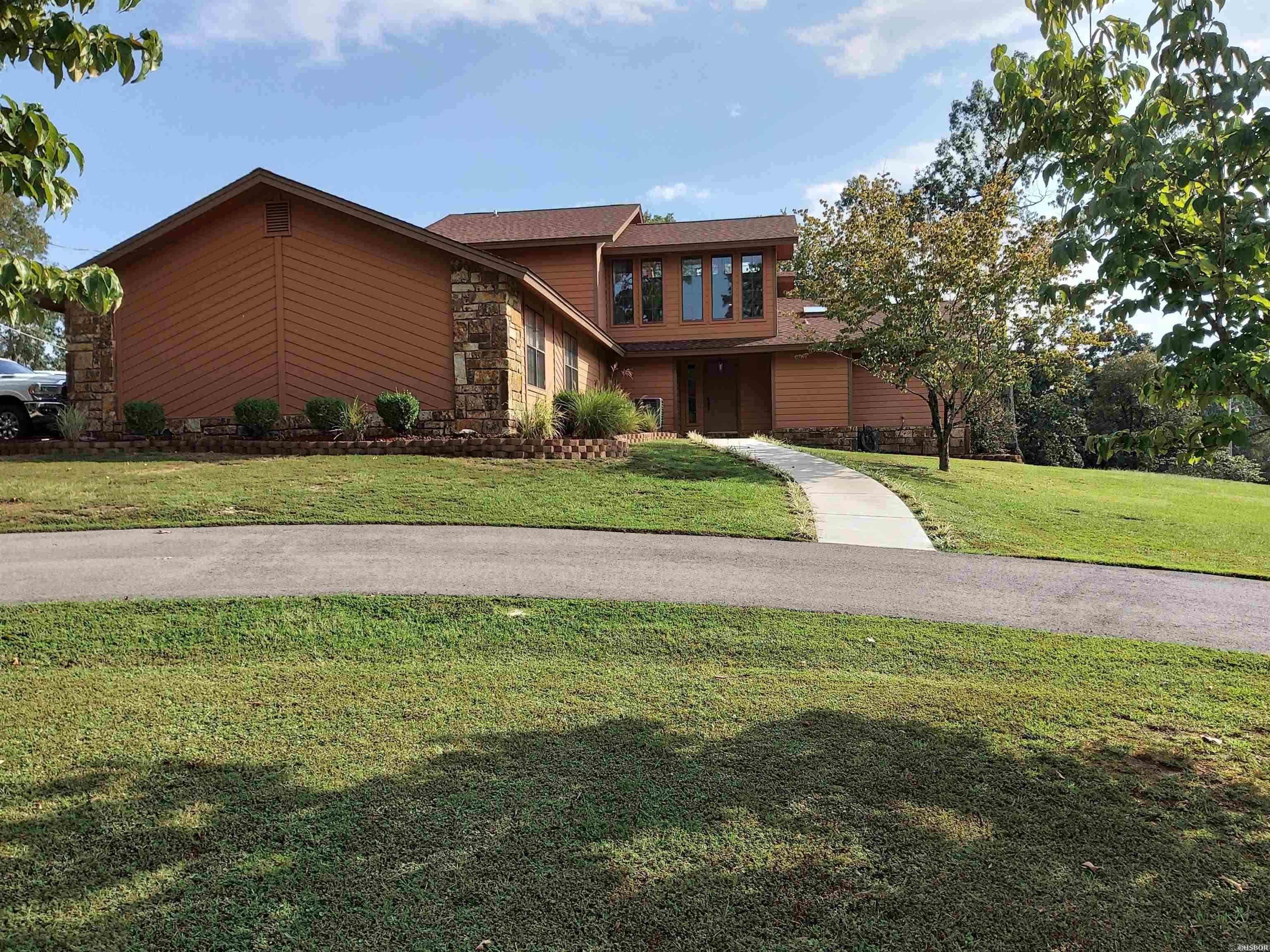 Welcome to this inviting 2-story home in the highly regarded Lake Hamilton School District, offering 3 bedrooms, 2 bathrooms, and nearly2,500 sq. ft. of living space. Designed with both comfort and function in mind, the spacious layout provides plenty of room for daily living and entertaining. Step outside to enjoy the expansive deck, perfect for summer cookouts or quiet evenings under the stars. All major appliances — including the refrigerator, washer, dryer, and even an ice maker — convey with the sale, making move-in a breeze. For those who need extra room for hobbies, storage, or a workshop, the property features a remarkable 30’ x 50’ utility building. Set on over half an acre, this home blends space, value, and convenience in one package. Whether you’re looking for a retreat, a place to entertain, or simply room to grow, 130 Sparling Road delivers.