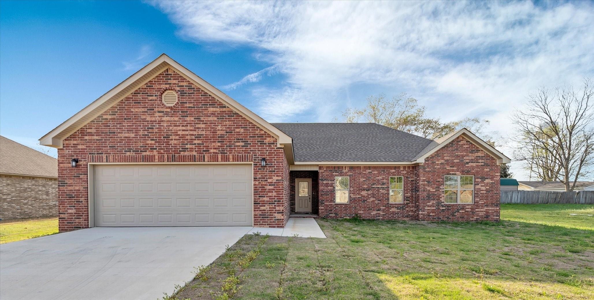 NEW CONSTRUCTION! ONE level, 3 bedroom | 2 bathroom home and BEAUTIFUL!! White soft close cabinets, granite countertops & laminate flooring flow seamlessly throughout! This home is very stylish, all electric homes has extra storage with lots of additional closets, a 2 door deep pantry in kitchen. The fireplace is featured in the large living room with room for a family dining table at kitchen side. Primary bathroom features a LARGE walk-in shower, separate tub, double vanities, his & hers closets & private potty. Great location! Minutes from Jonesboro! Come see this beautiful home on Pecan Street in Lake City today!