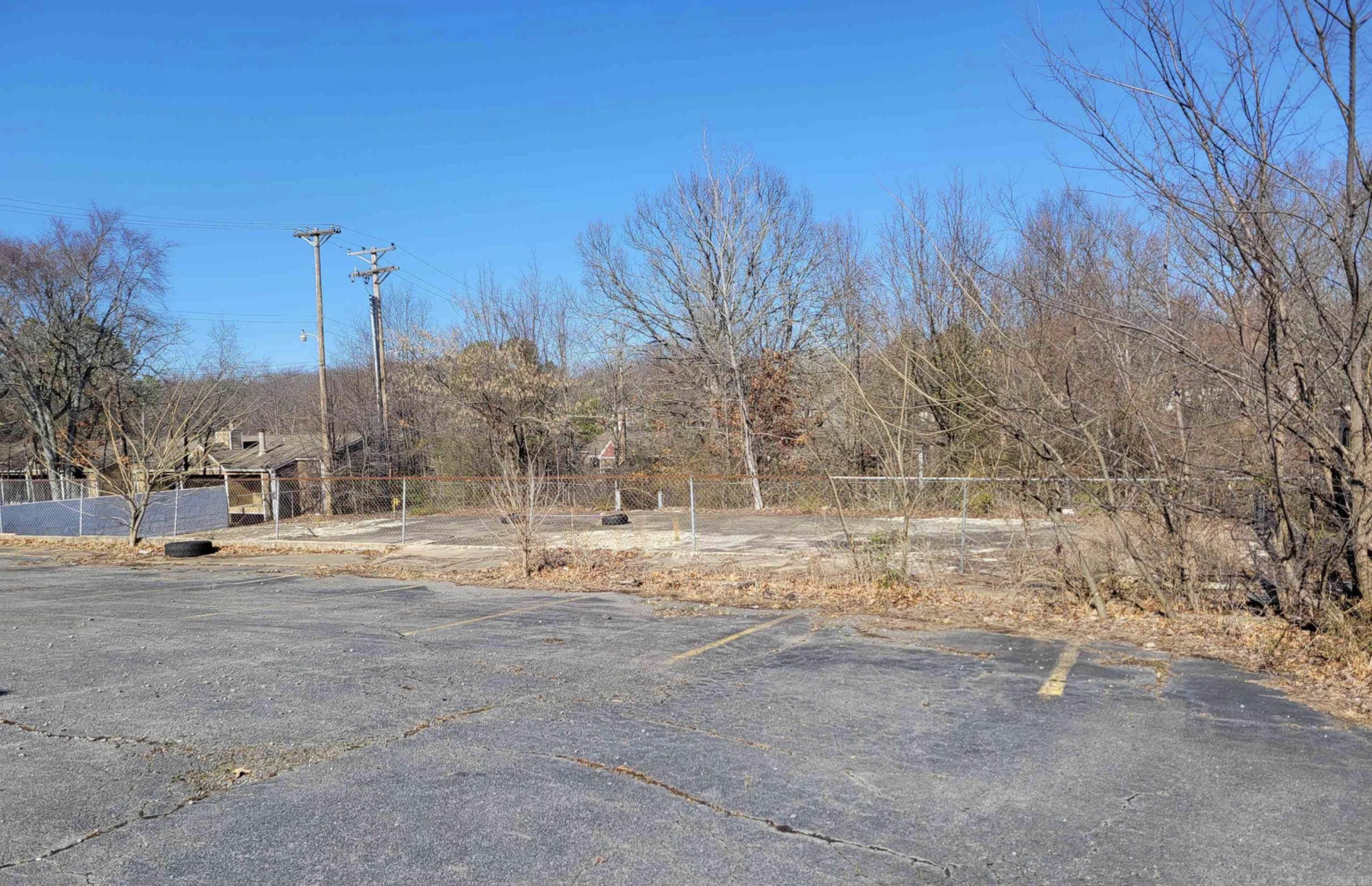 Prime commercial property available near the high-traffic intersection of North Hills and Hwy 107/JFK Boulevard in North Little Rock. The site features a paved parking lot with around 20 spaces, making it ideal for a small professional service business or duplex/apartment buildings. Surrounded by restaurants, retail, and multifamily housing, this location could not be more convenient.