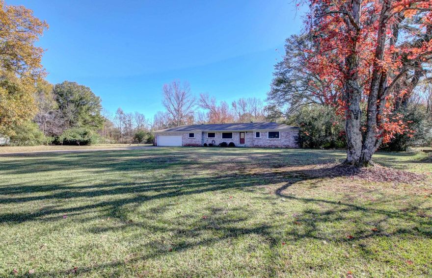 Discover the perfect blend of classic charm and modern updates at 2875 Highway 367 N. Nestled on 1.59 picturesque acres, this spacious 4-bedroom home boasts all of the original hardwood floors! Abundant natural light in every room creates a warm and inviting environment! A bonus area off the main bedroom features brand-new flooring, adding a fresh touch to your private retreat. The home also features a bright and versatile utility/sunroom, offering a perfect spot for enjoying morning coffee, tending to plants, or creating a cozy relaxation space. Recent upgrades, including a NEW ROOF (2022)  NEW AC (2024) , and updated breaker boxes, provide modern comfort and efficiency. Outside, this property truly shines. A massive 40x40 SHOP with electrical is ready to accommodate a wide range of projects, hobbies, or storage needs, while an additional storage building offers even more versatility. The expansive acreage provides plenty of room for outdoor activities, gardening, or simply enjoying the privacy and surroundings.This home is a rare find that seamlessly blends space, functionality, and charm. Agents please see remarks.