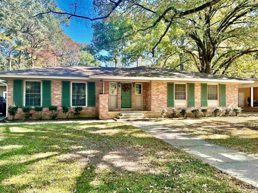 Very well-maintained older home built in 1955. Property has been mostly updated over the last 5 years. Carport was taken in as a sunroom/office with great storage.  Large den with wood-burning fireplace to keep warm on those cold nights. Den has great windows to look out into the backyard.  Beautiful kitchen!  Updated with granite counter tops, double ovens, lots of cabinets, laundry closet with new tankless water heater. This home is plenty of entertainment space with separate dining room and formal living room. Foyer has original brick pavers.  This property features 3 bedrooms and 2 updated bathrooms.  New flooring in most of the home too. Roof is 3 years old, metal roof on back half of house is appx 10 years old. This is a must see to appreciate all the charm!