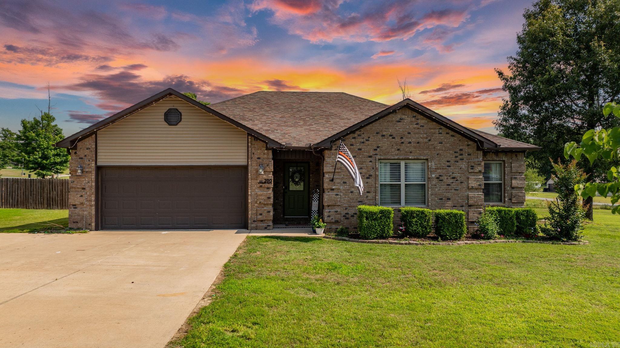 The country living feel but close enough to town, you won't want to miss this house! Featuring 3 bedrooms and 2 bathrooms, with open concept living areas. Master bedroom laminate flooring while the 2 extras bedrooms have cozy carpet. The kitchen is spacious enough for an eat-in area and breakfast bar both to fit the whole family at once! Walk in pantry contains tons of shelving and room for a second refrigerator. Updated features include fresh paint in main living areas, added fireplace with stone, and new flooring in the master bedroom. In the backyard you'll find a huge privacy fence and a covered porch for all your entertaining! All of this sitting on a 1+ acre corner lot! Get your private showing scheduled before it's too late!!