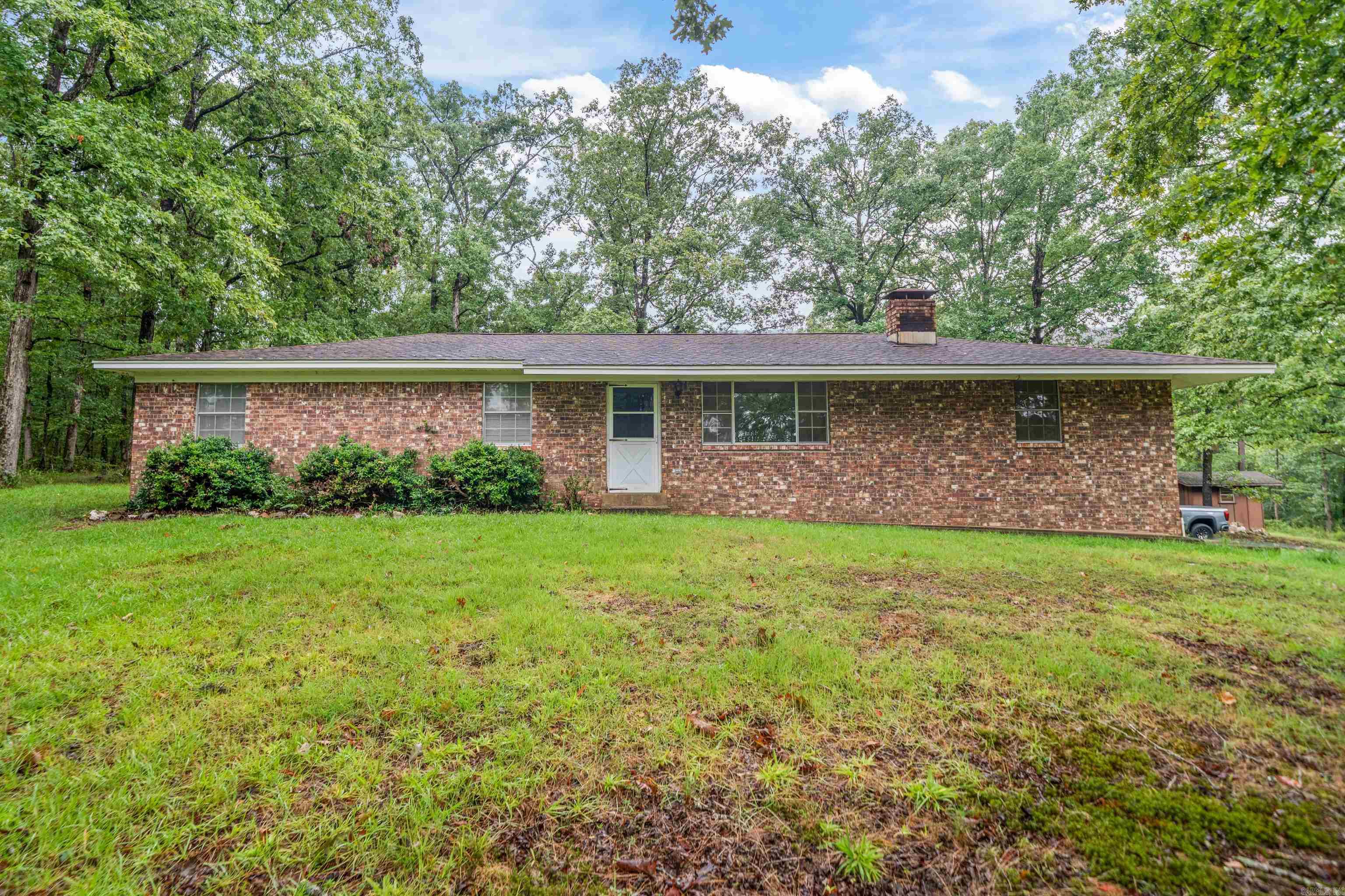 Discover this charming 3-Br., 2-Ba. home nestled on a beautifully wooded 5.35 acre property that offers the perfect blend of tranquility and convenience. The private setting creates a peaceful retreat where you can enjoy morning coffee while listening to bird's chirp among the mature trees that surround your future sanctuary. Despite feeling wonderfully secluded, you'll appreciate the great central location that keeps you connected to everything. The thoughtfully designed floor plan maximizes every square foot, creating comfortable living spaces that flow naturally from room to room. Quality schools are nearby, including Magnet Cove High School, making this an ideal choice for families. The wooded property provides natural privacy and creates a park-like atmosphere right in your backyard. This property perfectly balances the serenity of nature with modern convenience, offering a lifestyle that's both relaxing and practical.