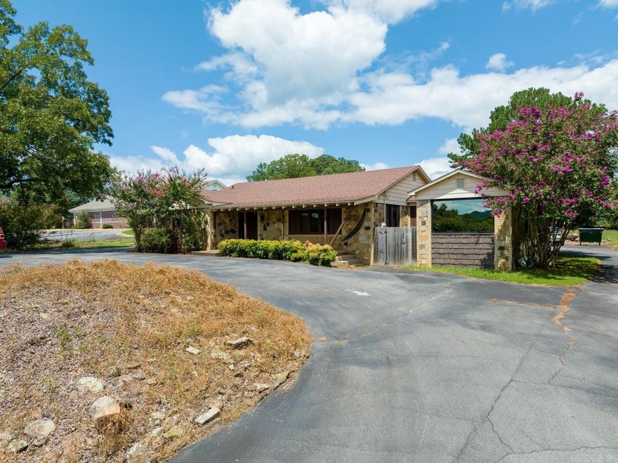 Great commercial building in Heber Springs with parking on all sides of the building!  Situated on almost 1 acre (just west of downtown Heber Springs), this rock building includes:  4 private offices  -  large conference room  -  large common work area with 4 built in desks and lots of storage  -  reception window and nice reception area with water fountain  -  2 bathrooms  -  handicap ramp and handicap accessible auto entry door  -  20 parking spots!  Building is in great condition!