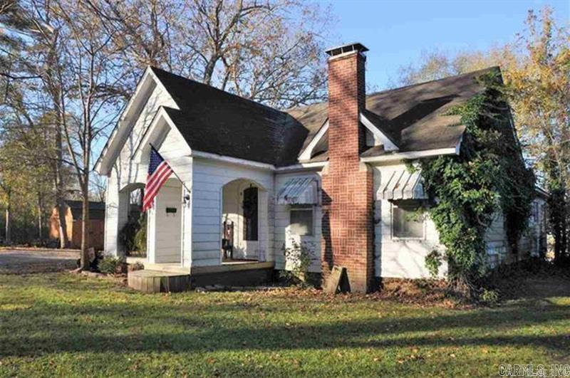 What a great 1940's mid-century home in Sheridan with so much character*added details you don't find in homes anymore*stunning arched doorways with 12" wood moldings*wood arched French doors*nice size dining room*built-in buffet*original hardwood floors*spacious living room w/built in shelves*cozy fireplace*lots of windows w/plantation style blinds*rewired with 12/2 romex*cute built in telephone nook in hallway*large master bedroom w/walk-in closet*laundry room*new central heat unit*the basement has two rooms with an entrance from the inside and outside of the home*large bath with shower and tub*storage building does not convey*survey under mls docs*