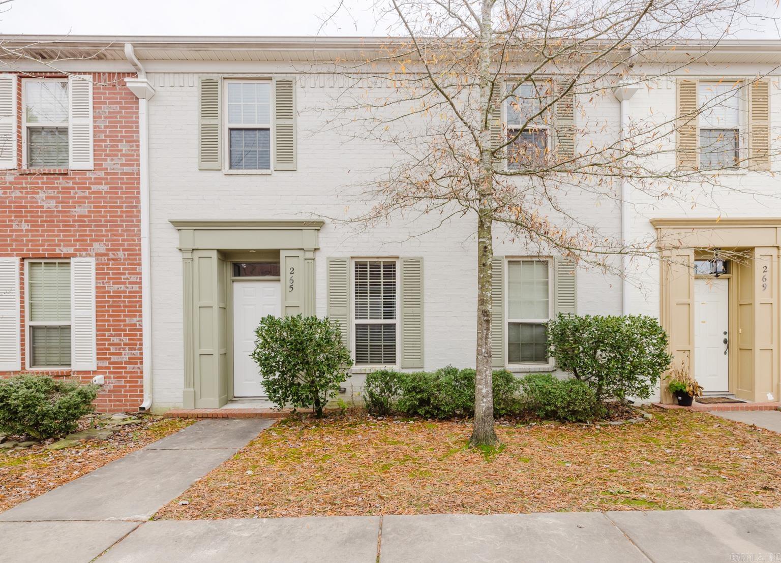 This charming 4-bedroom, 2.5-bathroom townhouse, located in the highly sought-after Bryant School District, is designed with both style and functionality in mind. The spacious layout includes a dedicated dining room and a cozy play area tucked under the stairs, perfect for family living. The kitchen features stainless steel appliances, plenty of built-in shelving, and ample storage, offering a practical and inviting space for meal preparation. Outside, a small sitting area in the backyard provides a private retreat for relaxing or entertaining.