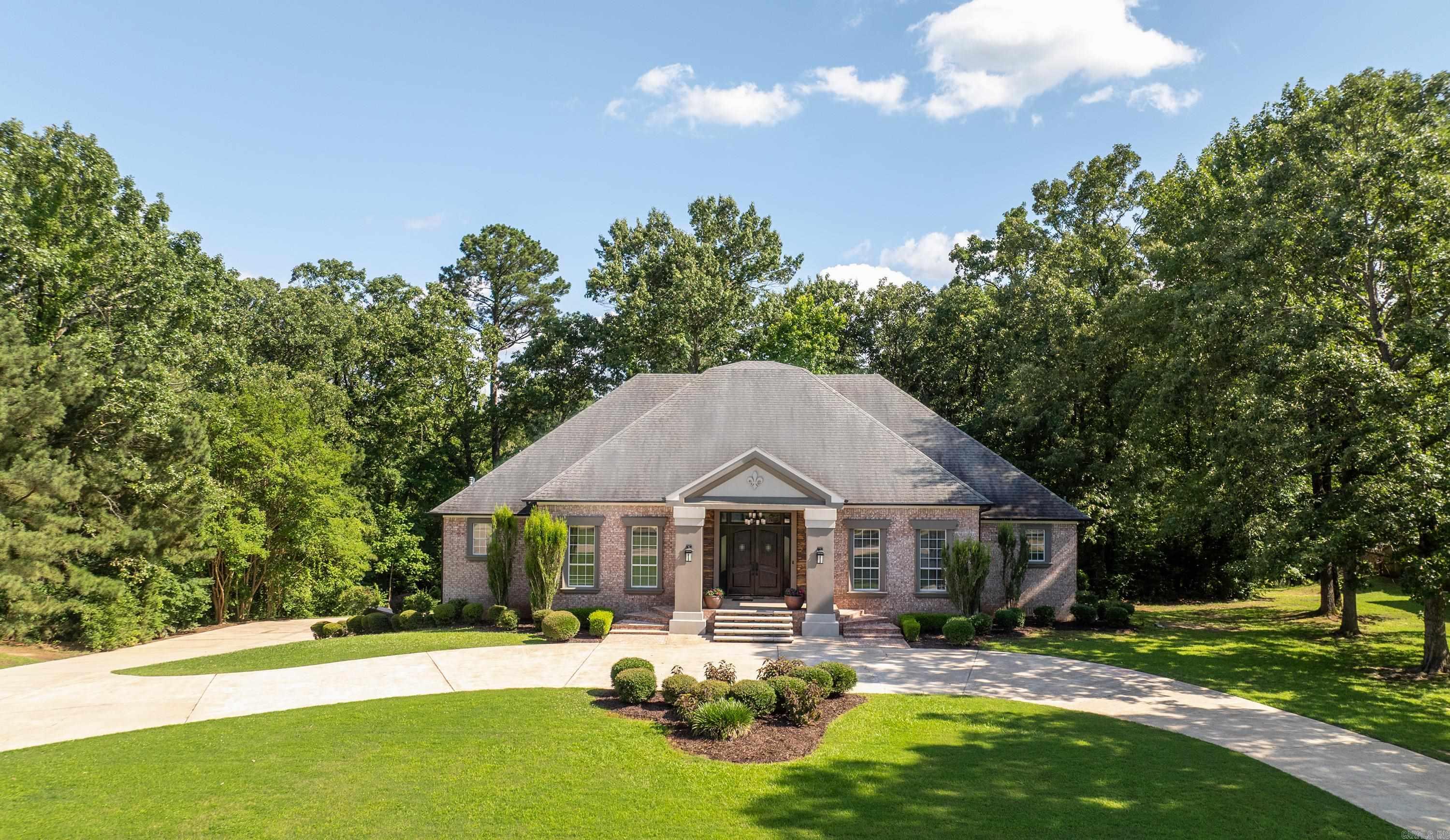 Let's Move in Today! Beautifully nestled into the lush hard scape of lovely Water Oak Street, this home has much to offer! Circle driveway is a wonderful first impression with spacious parking & driveway. The home has a modern flair with mixed stack stone accents on stairs, stucco Columns & heavy dark stained double front doors. Entrance with tall ceilings and throughout is expansive offering formal dining & family room nearby. The kitchen is amazing for the chief that needs plenty of space to create wonderful meals. Home has a great flow for entertaining. Master Suite is large &comfy with a dream spa tub to enjoy for two. Two more bedrooms on entry level& Jack in Jill bath. All 5 bedrooms are generous in size, as well as all closets. The downstairs has Media room, fireplace, and two bedrooms &bath. Outside patios off of kitchen, screened porch off of family room, & outside covered patio for downstairs. This home is ready for you and your family.