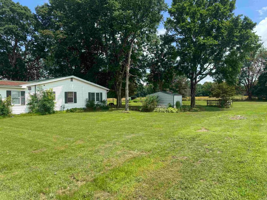 This spacious 1,730 sq ft home offers great bones and tons of potential with just a little TLC. Featuring two living areas, it provides plenty of room for family gatherings or entertaining guests. The large backyard is a standout, boasting mature shade trees, two storage sheds, and a back patio with a shop—perfect for hobbies or extra storage. A 2-car carport adds convenience, and the layout offers flexibility for customization.    Whether you’re looking for your next investment or a place to make your own, this home is full of possibilities. Don’t miss out on this value-packed p