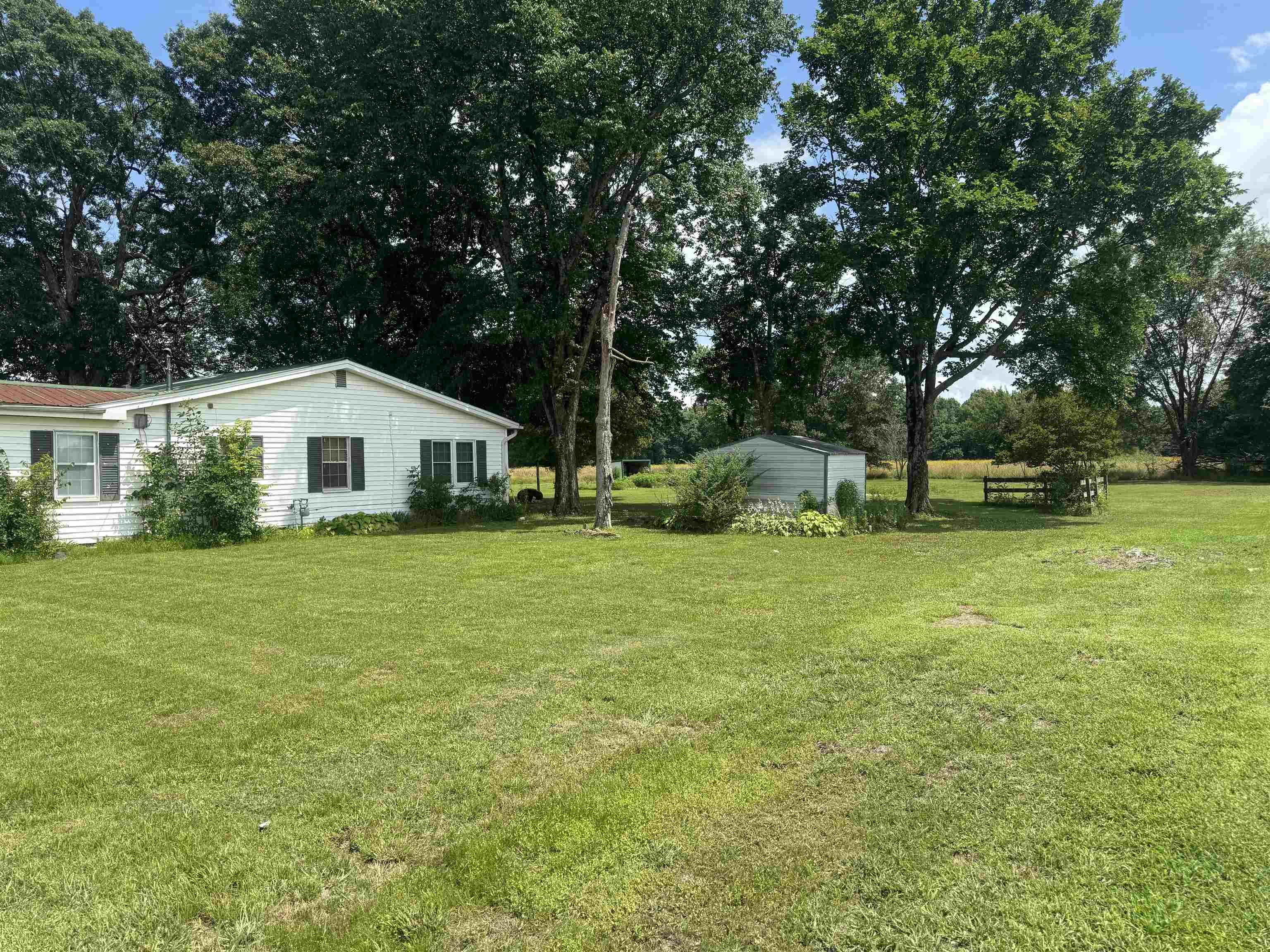 This spacious 1,730 sq ft home offers great bones and tons of potential with just a little TLC. Featuring two living areas, it provides plenty of room for family gatherings or entertaining guests. The large backyard is a standout, boasting mature shade trees, two storage sheds, and a back patio with a shop—perfect for hobbies or extra storage. A 2-car carport adds convenience, and the layout offers flexibility for customization. Whether you’re looking for your next investment or a place to make your own, this home is full of possibilities. Don’t miss out on this value-packed p