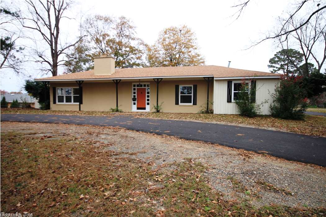 Large remodeled home sitting on 2 lots. 3 bedrooms and 3 baths. Some of the updates are: new electrical wiring, plumbing, 2 hot water heaters, 2 new heat and air units, windows, appliances in kitchen, ceiling fans in every room, tile in kitchen and baths, refinished hardwoods and paved circle driveway. Large game room and indoor patio. 2 fireplaces.