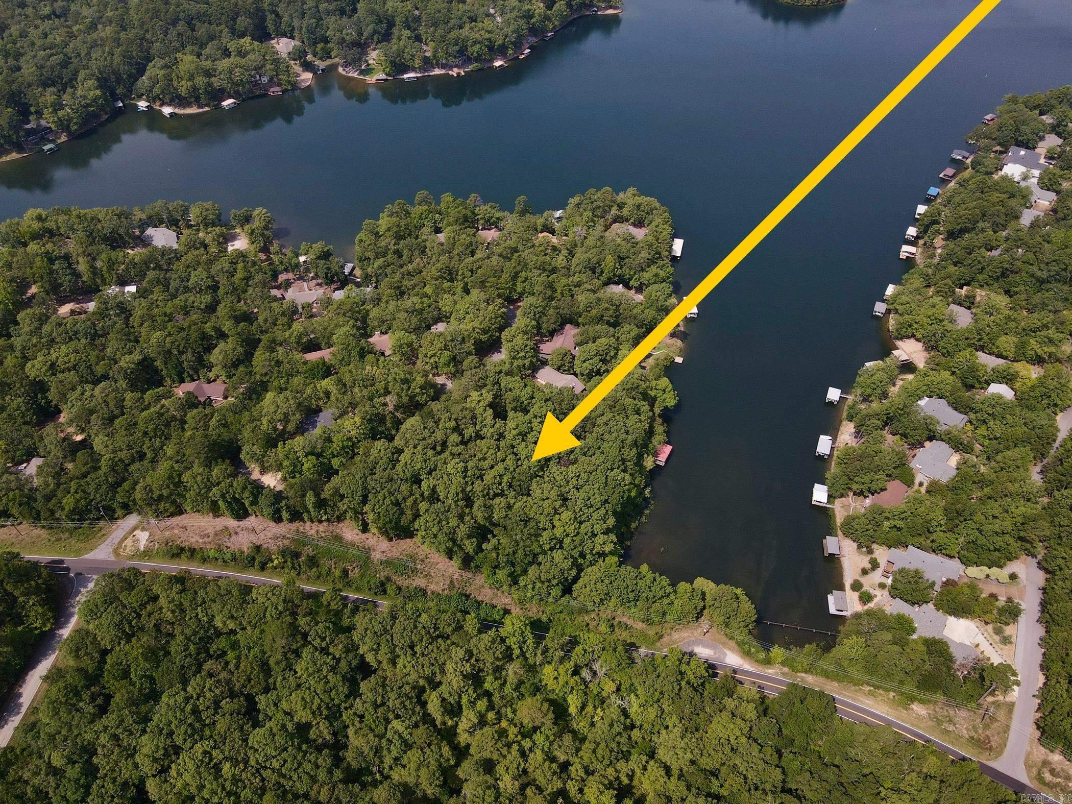 Waterfront sloped lot on Lake Cortez. Come build your new lake front home in Hot Springs Village! It is home to 11 recreational lakes, nine championship golfcourses, 13 tennis courts, 14 pickleball courts, 30 miles of walking trails, more than 200 clubs and organizations and numerous additional activities for allages. Spanning 26,000 acres of the Ouachita Mountains, Hot Springs Village is the largest gated community in North America. New Member Buy-in Fee due at closing.