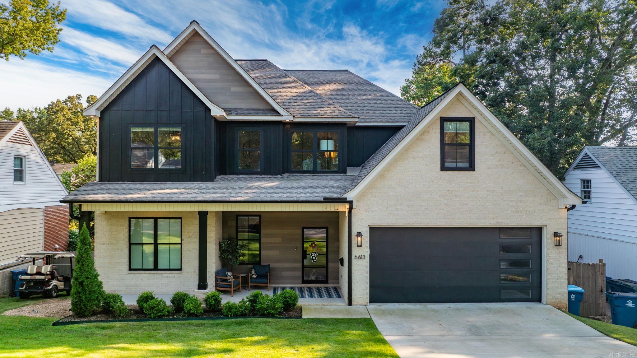 Wonderful home built in 2022! Full of natural light, this home both a covered front and back porch with large windows along the back of the house. White oak wood flooring is throughout the downstairs. The kitchen cabinets are a beautiful oak wood and the island is large, providing extra island seating. There is a wet bar that leads into the huge walk in pantry which gives abundant extra kitchen storage. The great room has a gas log fireplace surrounded by built ins. Beautiful primary bedroom with fantastic bath and huge walk in closet is on the main level. A guest bedroom with full bath is also on the main level as well as the laundry area when you walk inside from the two car garage. Upstairs is a kids hangout area at the top of the stairs with four bedrooms off the hangout area. Two full baths upstairs - one is a jack and jill and the other opens to the hallway as well as inside the bedroom. There is a very large heat and cooled storage room as well. This is a fantastic floor plan and feels like a brand new house! Walk to Jefferson elementary, Baker Park and the Cammack tennis courts!