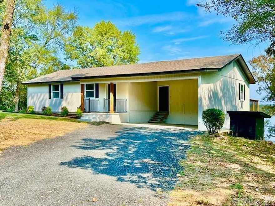 " It's All About The View, The View, The View". Step inside this totally renovated Lake Side Home, and start living your best life. This 1280Sq' Home sits on almost a half a lakefront acre and has all new HVAC, Plumbing, Electrical, Windows, Flooring, Custom Cabinets and Granite Counter tops. Luxury Bathrooms and a Master On-Suite. As you enter the home, the lake is waiting to greet you. The Large Kitchen has a magnificent Island, abundant cabinet storage and is laid out for the most discerning Chef in the house. Designed for entertaining with an open floor plan and easy access to the newly built large raised outdoor deck. Enjoy your coffee as you take in the magnificent lake view and the mountains in the distance. The outdoor space is perfect to share with guests and boasts a Large lower landing, newly concreted, to add your gazebo or outdoor fireplace area. Large side yard would offer space for a storage shed or additional garage to the existing house double carport. Closet in kitchen corner to be used for stackable washer and dryer and extra storage. New septic installed. Seller is offering a $3500 Appliance Allowance to complete your kitchen. 1-Year Home Warranty is included.