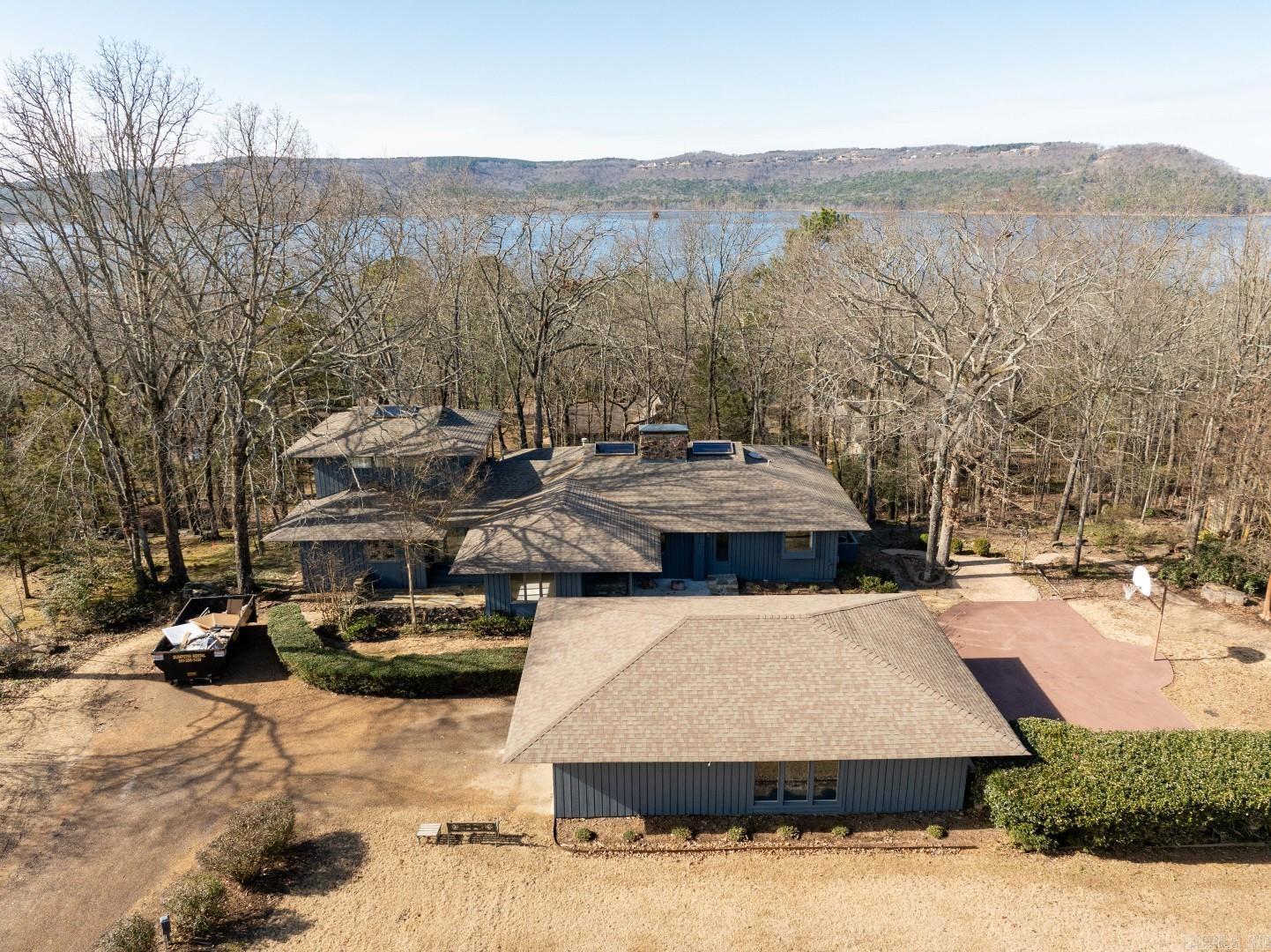Eden Isle - Frank McGary Design! This lovely, architectural home, close to the Red Apple Inn, sits in a very private setting (1.08 acres) overlooking Greers Ferry Lake and lots of beautiful large boulders! 3 bedrooms plus a spacious 2-car garage that's finished out for additional living/bedrooms with independent heat and air! Sunken greatroom with very tall cathedral wooden ceilings, massive stone fireplace, updated kitchen with new tops and new appliances, wetbar, 2-covered decks (one is great for cooking near the kitchen), high-end windows, new exterior paint, all new bathrooms, master includes an extra living area upstairs that could be an office, grandkids bedroom etc! 2-minute walk to the Red Apple Inn, 5-minute golf cart ride to Eden Isle Marina! A wonderful location and a great house! Taxes are estimated.