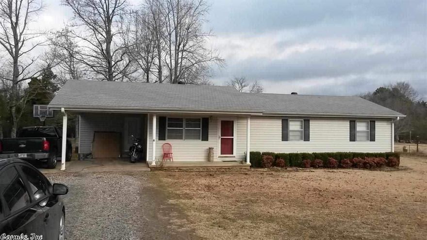 Great starter home just minutes from town. This home has new paint and new flooring in the hall, bathroom, and in the living room.  Als, freshly painted! The covered back porch provides a great place to relax.  HUGE fenced in back yard.