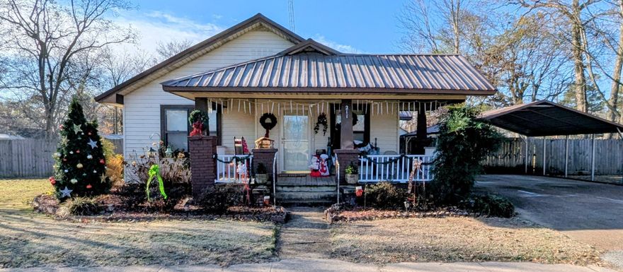 Well-maintained 3BR, 1.5BA home offering 1,504 sq ft. Recent updates include HVAC (2023) and metal roof approx. 10 yrs old. Detached 2-car carport plus two storage buildings—12x24 w/ electric and 6x8. plus, one extra detached carport in the back yard. Safe room built onto home easy access. Bathroom has walk-in shower.  Fully fenced backyard on a .49-acre lot enhances outdoor living. Spacious layout, natural light, and practical upgrades make this property a standout. This property won't last long! Remember Don't Buy or Sell Alone!