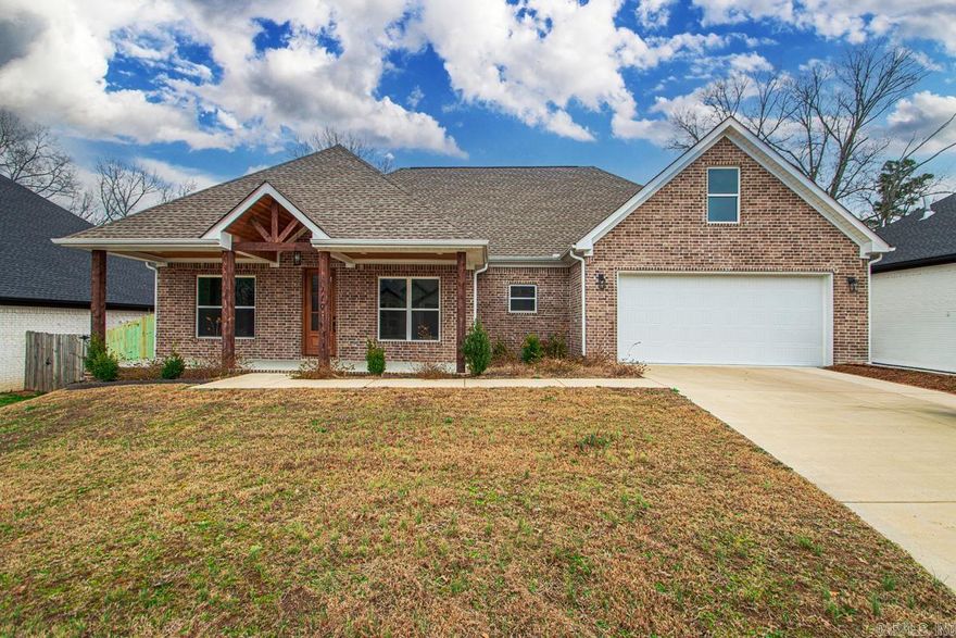 This thoughtfully designed new construction home is filled with natural light and intentional details, set within the desirable Harmony Village neighborhood just minutes from everything Benton has to offer. High ceilings create an airy, welcoming feel throughout the open living and kitchen spaces, where an open kitchen layout and butler’s pantry make both everyday routines and entertaining feel effortless. A dedicated office provides the flexibility to work from home or serve as a fourth bedroom as life evolves. The primary suite is a true retreat, featuring a spa like bathroom with a soaking tub, walk in shower, and a pass through laundry room that leads directly into a massive walk in closet designed for ease and organization. Outside, the covered back porch with an outdoor fireplace becomes the heart of the home in every season, offering a place to unwind or gather as the sun sets. The fully fenced backyard adds privacy and room to relax, play, or garden. This home blends modern comfort with timeless livability in a location that keeps you close to everything while still feeling settled and serene. Book your private tour today!