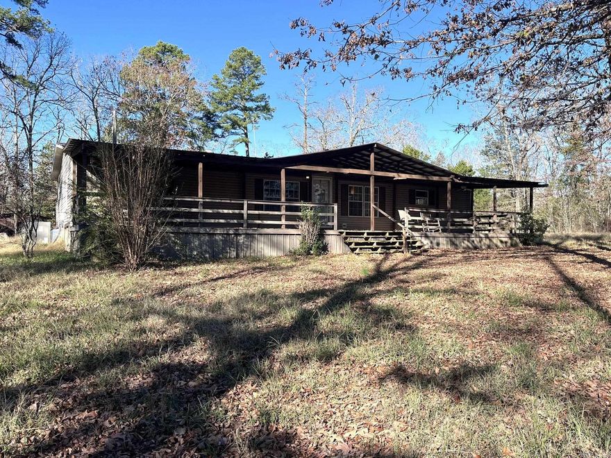 Peaceful location with 3 acres to enjoy country living.  Mobile has 2 living areas (one with a fireplace), Dining Room, Covered porch, and tin roof.  HVAC is about 3-4 years old.  2 storage / out buildings.  Some updates had been previously made.  Taxes are estimate only and should be verified by buyer. Agents see remarks