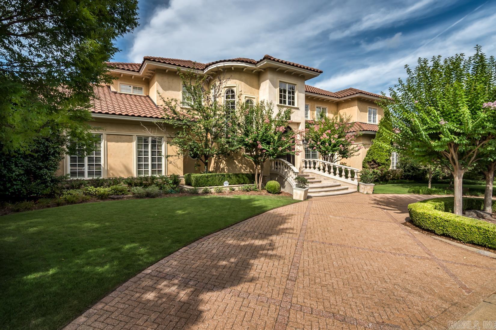 Magnificent Estate Home located inside the gates of the Deauville neighborhood of Chenal. Elaborate custom details adorn the beautifully proportioned rooms of this 8,000 ± square-foot residence. The family home was custom designed for a comfortable and casual lifestyle with the ability for large scale formal and informal entertaining. The incredible outdoor spaces include multiple covered and uncovered garden rooms with an outdoor kitchen for food preparation and dining. Motor court & four car garage.