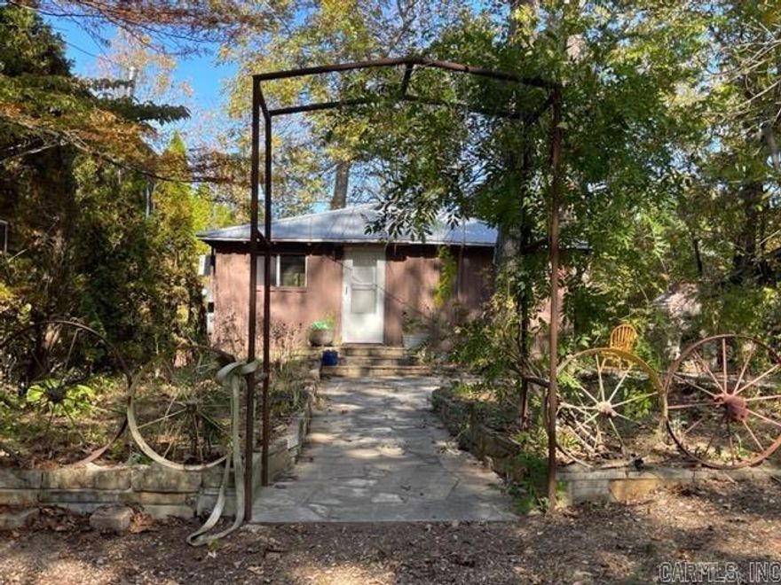Quaint cabin for sale on the Spring River in Hardy, Arkansas! This Riverfront property for sale has 552 sq. ft. with 1 bedroom, 1 bathroom, a kitchen/living room area & a 10' x 23' screened in back porch that could be enclosed to add 240 sq. ft of additional living space.  Or keep it as is, it’s the perfect spot to enjoy a cup of coffee & the peaceful sounds of the river.  One of the earliest cabins built on the river with carefully selected, modest updates to retain its rustic charm. With an 8' x 10' site built storage building. Words cannot describe how utterly fabulous this vintage cabin is, it needs to be seen in person, schedule an appointment today!  One of the best features of this Arkansas riverfront home for sale is not only the private access to the river, but the custom stone work around the cabin and down to the river’s edge. Custom Rock bbq site built on Rock patio.   Storage building to convey and all River toys.   This property in the Rio Vista First subdivision; it has strictly enforced covenants. No AirBnB’s here, just a quiet community of neighbors.  Plus an additional community access point to the Spring River.