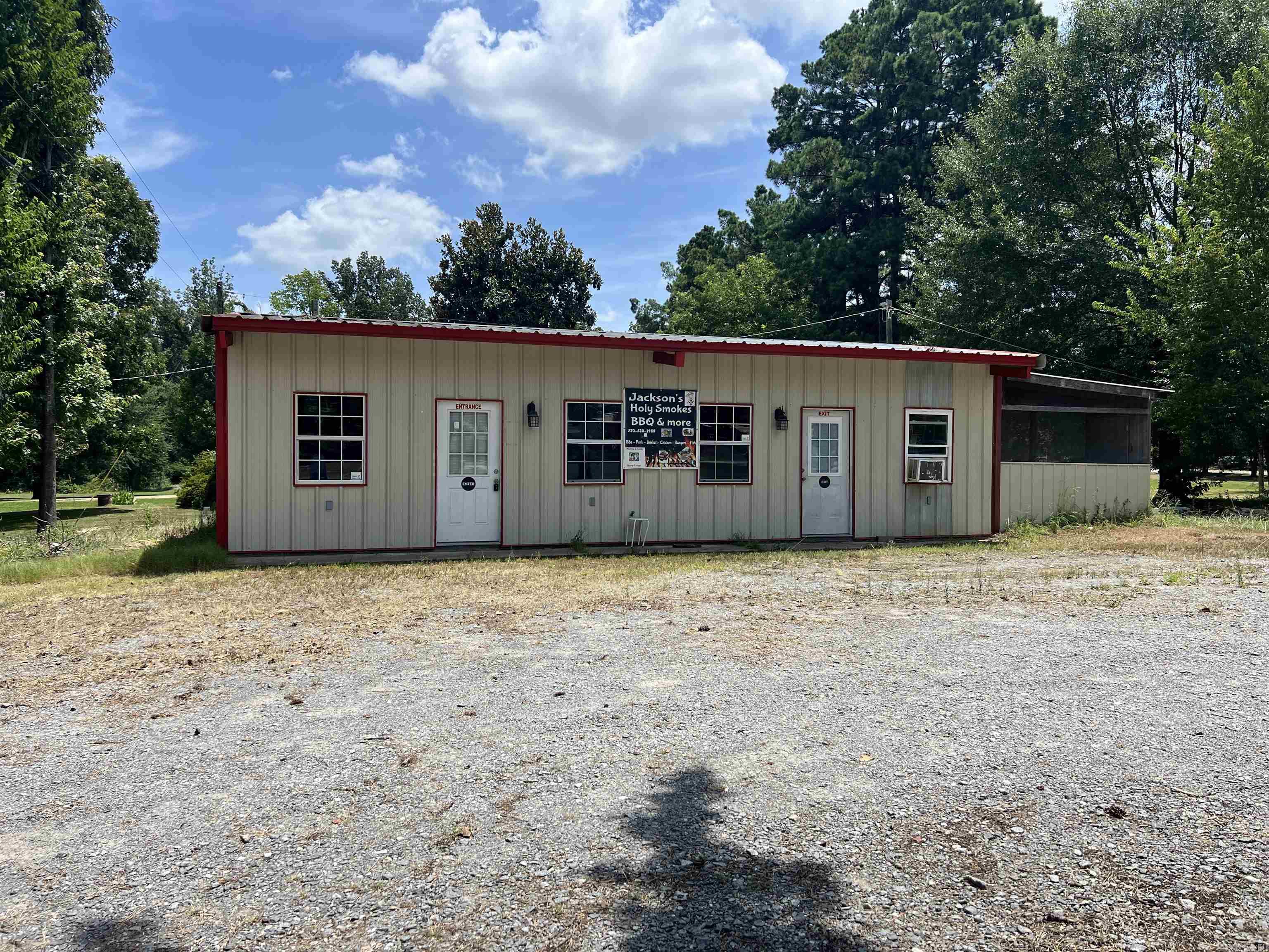 This sale includes a 900+ sq ft commercial building (formerly Jacksonās Holy Smokes) and a single family residence. The home is 1100+ sq ft in need of work. The business can be kept as a restaurant or divided for two office spaces. There are two bathrooms and two separate entrances. The two buildings sit on .62 acres on US HWY 425 giving high visibility for your business venture.