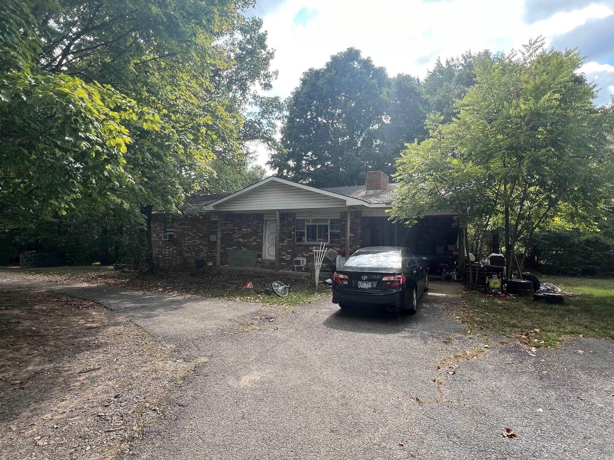 Brick home located inside the city limits of Clinton. Highway 65 frontage Property can be used for residential or commercial purposes. Up to 42 acres are available for larger development