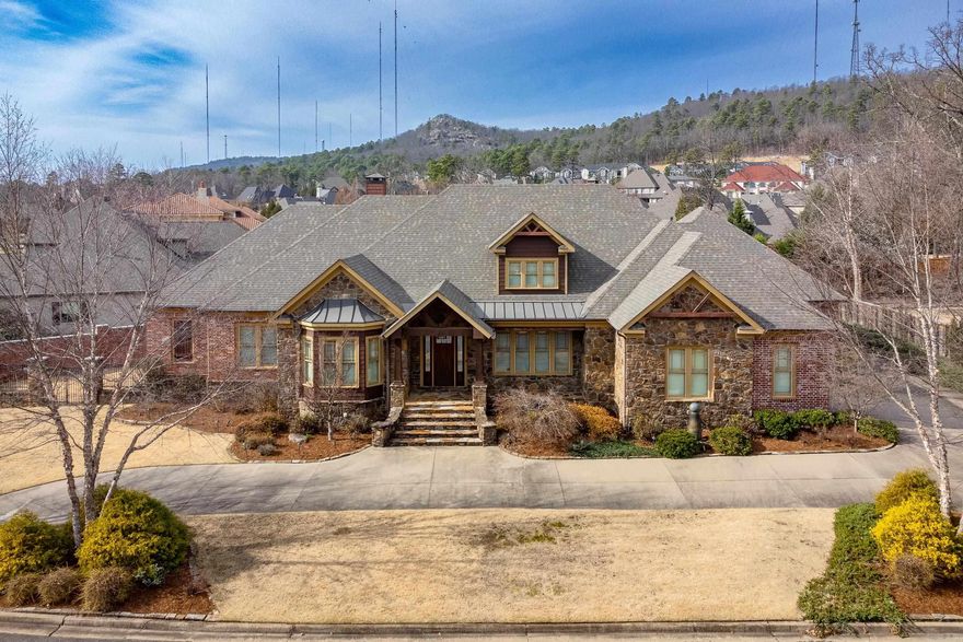 Charming and spacious home with gorgeous oak floors, tall ceilings and craftsman touches inside and out. Custom built cabinetry, impressive millwork, huge closets in this desirable floor plan are just some of the many features you'll love in this well maintained, stately home that lives like a one level. Fantastic kitchen with informal dining, plenty of storage, work space and SS appliances including gas downdraft range. Luxurious primary suite provides cozy sitting area and elegant bath. Formal living and dining areas as well impressive office/study and 3 guest bedrooms with baths. Upstairs has flexible space with bedroom, bonus and full bath. Garages accommodate 3 vehicles and golf cart. Enjoy the brick fenced back yard from covered and uncovered patios. Golf course/cart path access across the street. Come see!