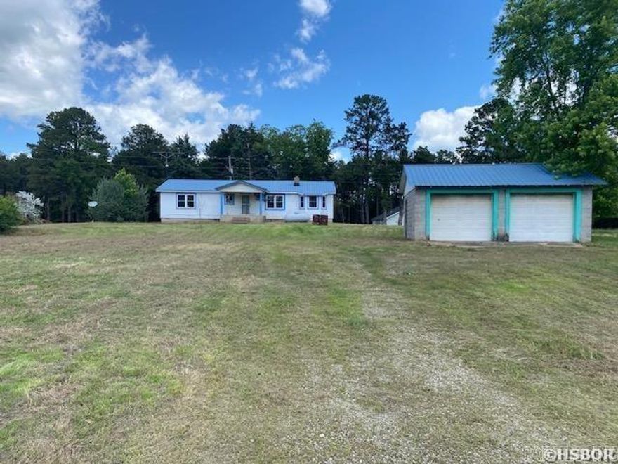 1 ACRE - LONDON, AR. $89,900!! 3BR 1.5 baths 1260sf family home offering lots of space and privacy.. detached garage parking + workshop, other stg bldg and covered front porch; lot lg enough for garden, pet run, additional buildings or add-on to house; property offers a mix suburban rural feel; lots to do, lots of history and easy access to larger towns for more or special events!! SOLD AS-IS