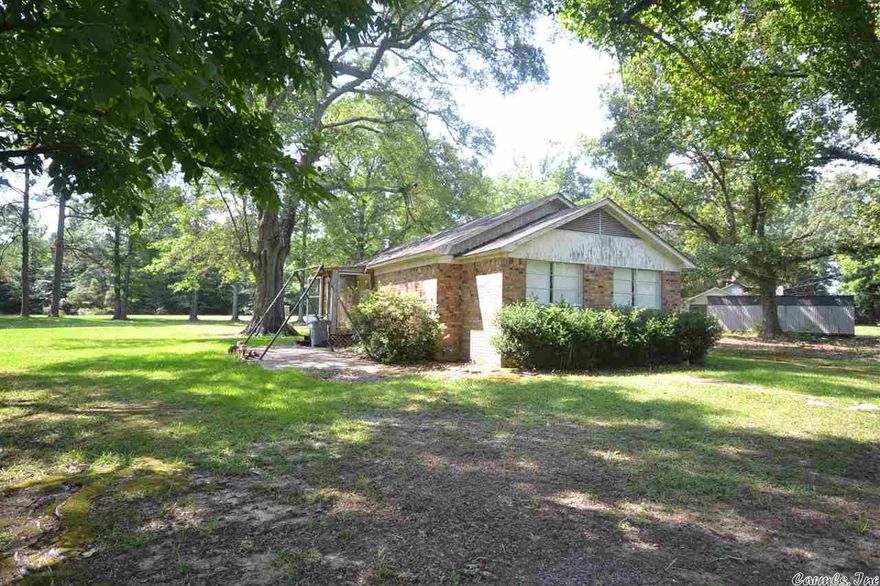 Property with great potential with 1 Bedroom/1 Bath on approx. 1.5 acres just north of Magnolia - needs total remodel!  **Measurement is for the purpose of marketing, may not be exact and is not for loan, valuation or other purpose. IF EXACT SQUARE FOOTAGE IS A CONCERN, THE PROPERTY SHOULD BE INDEPENDENTLY MEASURED.**