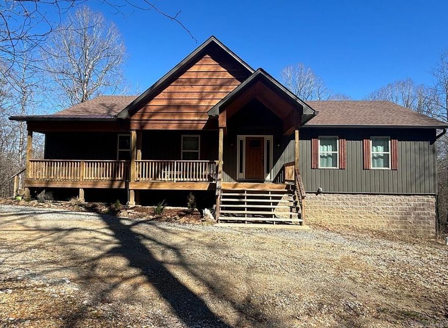 With its open floor plan, this beautiful custom built home sitting quietly on 2.5 acres in the woods could be your own secluded and peaceful oasis. Located just outside of town, the 3 bed  2 1/2 bath home is just minutes away from grocery, dining, and entertainment.  This house offers an office, a nice screened in back porch for hanging out and enjoying the weather, and a walkout basement that could offer about 800 more sq ft. The basement is equipped with a roll up caddy door, perfect for parking your ATVs, mower, or many other uses. With the large windows, there is plenty of natural light in the dining and living spaces of the home. All bedrooms feature walk in closets. The secondary bedrooms each feature built in desks and their own lavatory/vanity areas leading to the Jack and Jill Bathroom.  Call or text to schedule your showing.