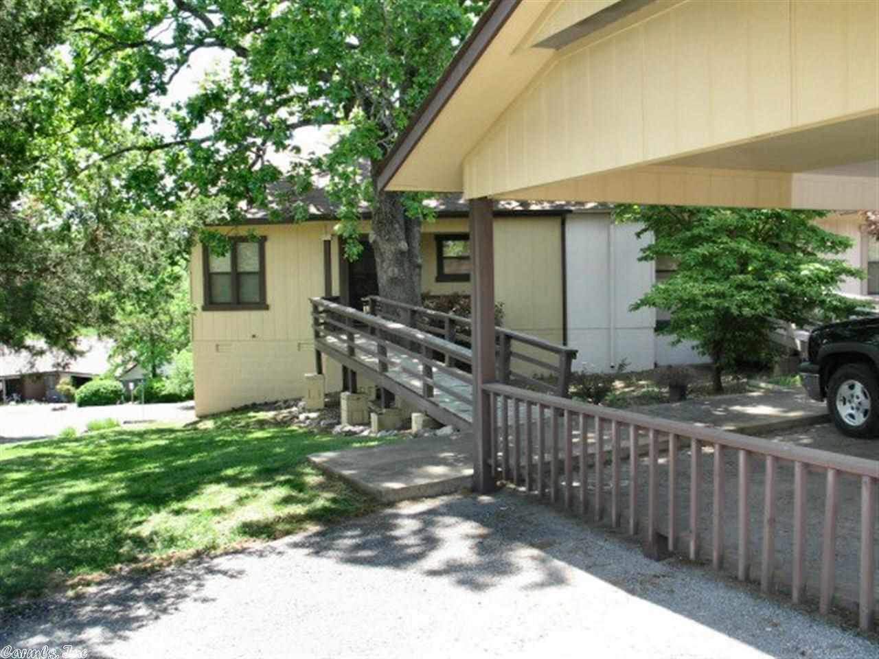 1 LEVEL TOWNHOUSE, WHAT A PRICE!! This townhouse has 2 bedrooms, 1 and 1/2 baths, living room, kitchen, breakfast nook, back deck, double carport, close to the Cherokee Village towncenter. Don't worry about lawn care anymore. Owner Financing Available!!