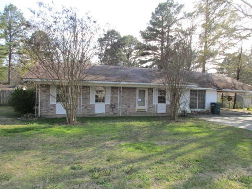 Brick home located in town.  3 bedrooms, 2 baths, carport, outside storage building, large backyard, partially fenced.  Large master bedroom with french doors leading out to backyard.  Large living room.  Taxes are after Homestead Credit.**Property was built prior to 1978 and lead based paint potentially exists.** Agents See Remarks**