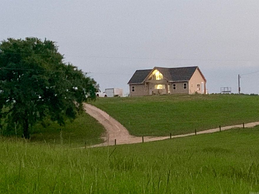 SLOW DOWN ENJOY THE VIEW! This property will have CADDO RIVER ACCESS!  Peaceful country living while close to town! This home offers views from every window! Sit in the living room or nice back porch while ceiling fans keeps you cool watching the sunset, deer and other wildlife. Back porch has a Sun shade sails.   5.25 acres+/- All electric. shop, and a metal storage