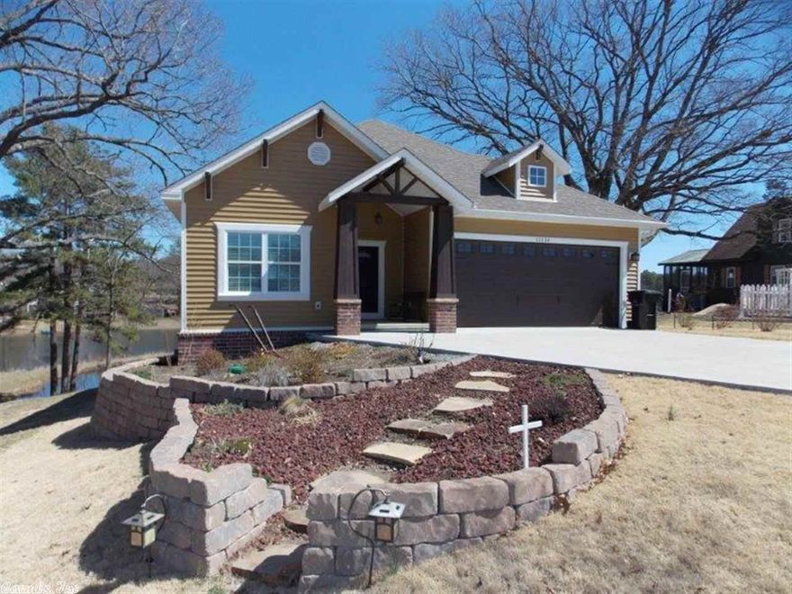 Awesome Craftsman style home on beautiful little lake! Open floor plan! Kitchen has large breakfast bar & tons of cabinets made of knotty Alder. Beautiful wood floors in great room. View of the lake from the master, living room, and screened back porch. All electric & very energy efficient! 24 X 30 shop.  It's a must see!