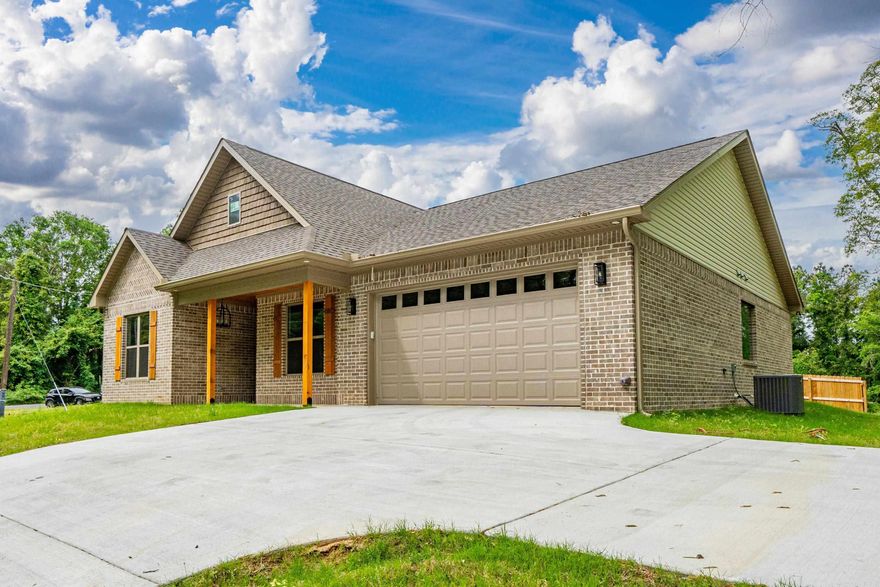 Built with care and designed for everyday living, this new brick home instantly feels like “the one.” From the moment you walk through the warm wood-framed front door, you’re greeted by soaring 9- and 10-foot ceilings and a soft, neutral color palette that makes the entire space feel bright, open, and timeless.  The kitchen is a showstopper — sleek cabinetry reaching to the ceiling, stainless-steel appliances, and gorgeous tilework that adds the perfect touch of personality. Every detail, from the custom cabinetry to the custom-built tile shower, reflects quality and thoughtful design.  In the primary suite, a tray ceiling adds a hint of elegance and spaciousness, creating a peaceful retreat at the end of the day. And with its convenient location near shopping, schools, and restaurants, this home blends small-town ease with everyday practicality. Move-in ready and built to impress — this is modern living done right.Agent is seller/owner.