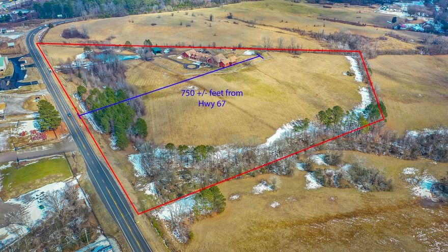 Recently annexed into Haskell, this property offers over 17 acres of land and from the middle of hwy 67 back 750ft zoned commercial it has a lot to offer. There is a large home with over 4,000sqft of garage/shop space as well as over 6,000sqft of living space between two homes all under one roof. For more information on the residential aspect of the property please see MLS #26005714