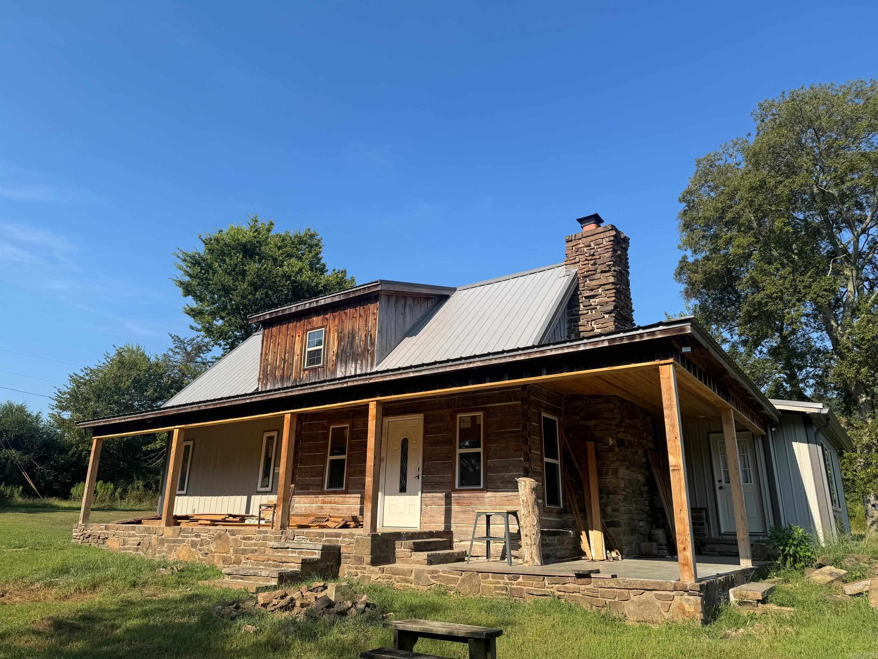 Discover this updated cabin that blends modern comfort with historic charm, nestled on 3.5 acres just outside city limits. Inside, youāll find a warm and welcoming layout with tasteful updates that enhance its character while maintaining its timeless feel. The property offers plenty of room to roam, garden, or simply enjoy the peaceful setting with privacy and space. A rare opportunity to own a unique home that balances rustic charm with everyday convenience.
