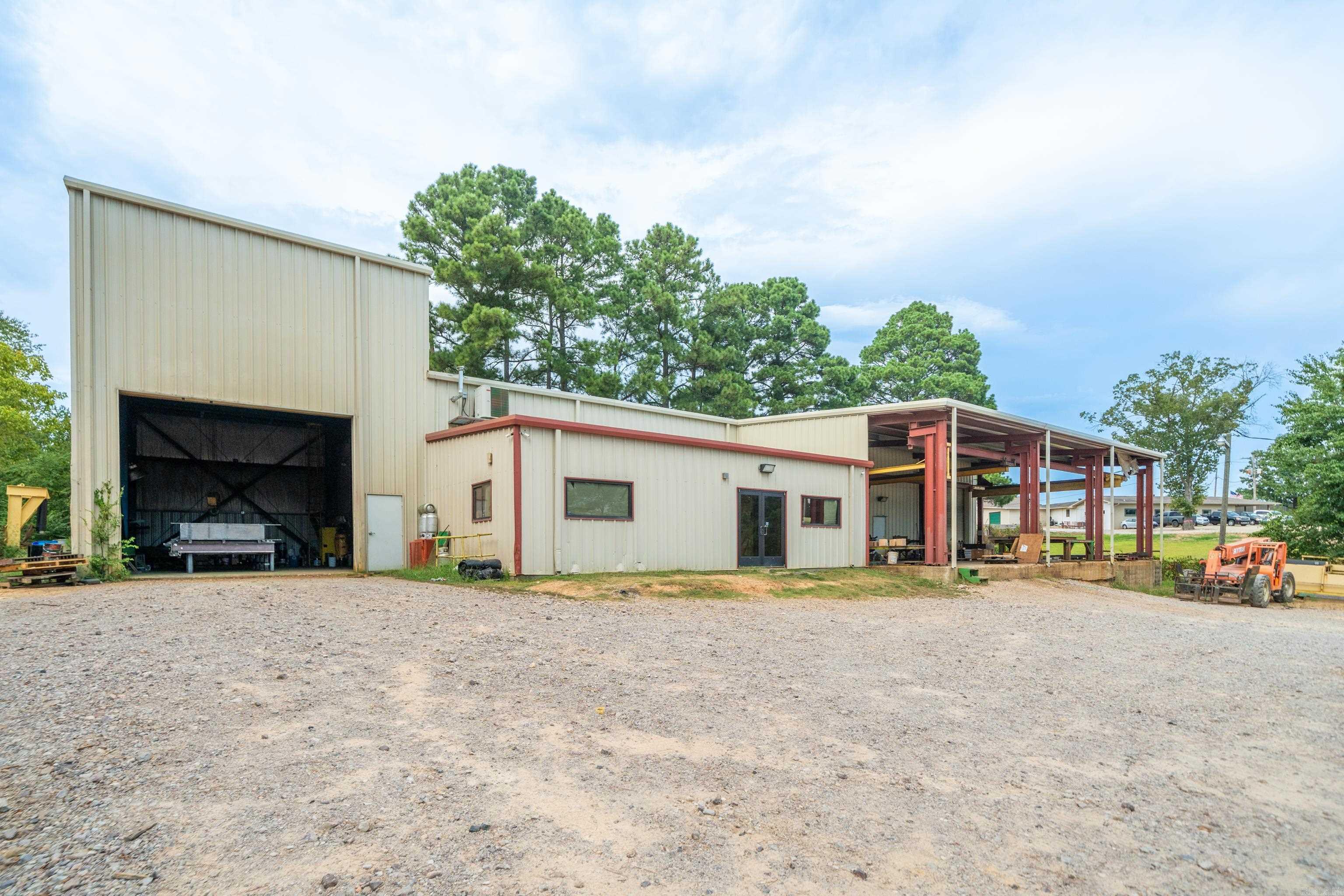Industrial property/Prime commercial location! Use could be a machine shop, warehouse, garage, etc. Building and land only.
