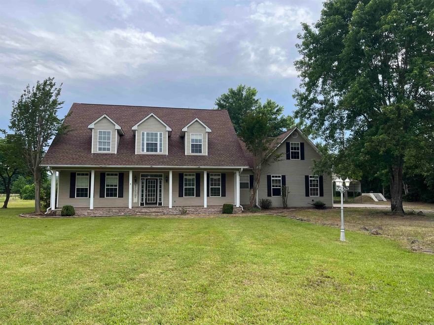Stunning Country Estate on 3.39 Acres! Welcome home to this beautifully updated country retreat offering privacy and modern comfort. Boasting 4 bedrooms, 3 full bathrooms, and a huge upstairs bonus room, this layout provides plenty of room for you to spread out. Step inside to find hardwood floors, brand-new luxury vinyl plank flooring in bathrooms, and inviting new carpet throughout. The spacious kitchen features butcher-block countertops for a country feel and a premium appliance package with adjacent walk-in pantry. Even the laundry/utility room is huge! Overhead lighting throughout (in closets, too) is complemented with ceiling fans in most rooms. Unwind in the hot tub on your oversized back porch while taking in views of your land, complete with mature trees, a seasonal creek in front, and private woods in back. Gather around the fire pit area for a relaxing evenings under the stars. Premium Features: Plenty of parking for you and your guests: 2-car attached garage, 2-car covered parking, and large gravel turnaround. Charming, glowing "Narnia-style" lamp post out front. Inground storm shelter for peace of mind.